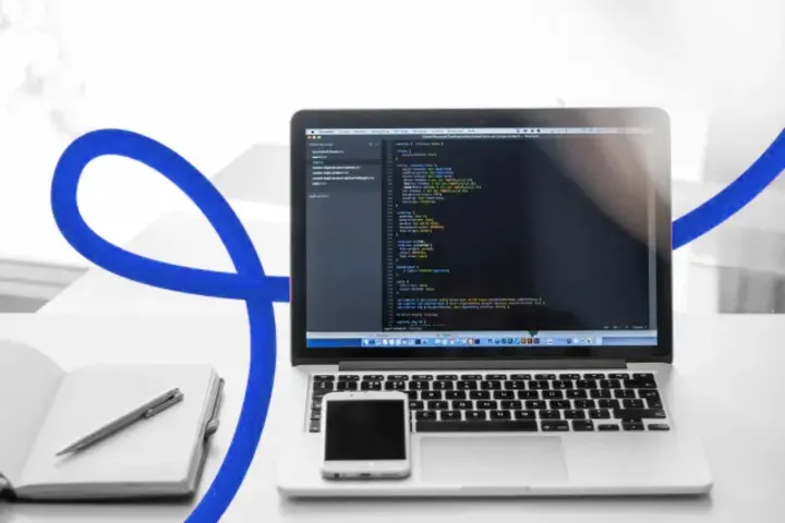 Website source code open on a laptop screen