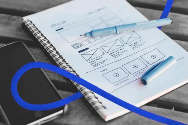 A website wireframe sketched in a notebook
